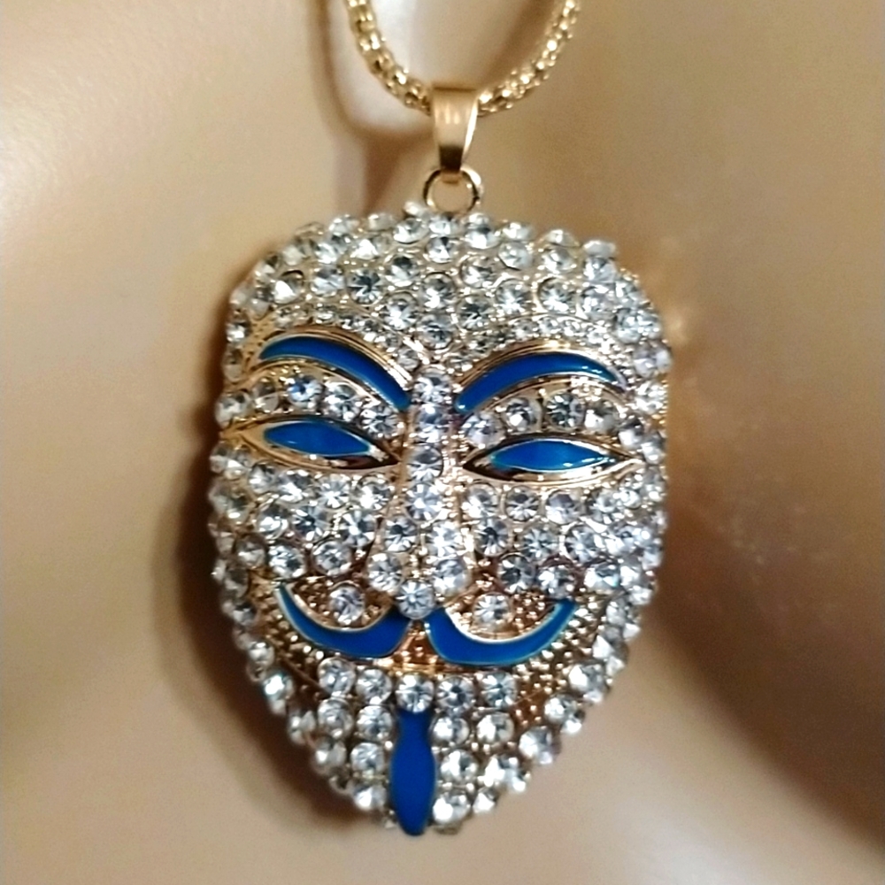 - 🎭Amazing crystal and gold Anonymous mask pendant on a 22" chain